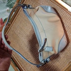 Coach Baby blue and cream colored mini bag.